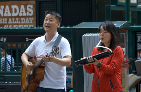 NEW YORK, NEW YORK/USA - July 27, 2019: Members of Church of Jesus sing praise songs during evangelizing event on Herald Square.のeditorial素材