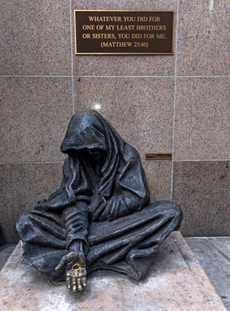 NEW YORK, NEW YORK/USA - July 8, 2019: Statue of Jesus desguised as homeless beggar in front of St. Francis of Assisi Church. Sculpted by Timothy P. Schmalz.のeditorial素材