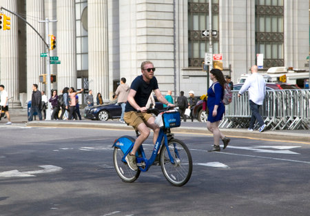 NEW YORK, NEW YORK/USA - May 7, 2018: Man rides rental Citi bike on Union Square East in Manhattan.のeditorial素材