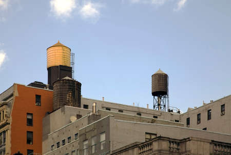 Water tanks on top of buildings roof tops in New York City.の写真素材