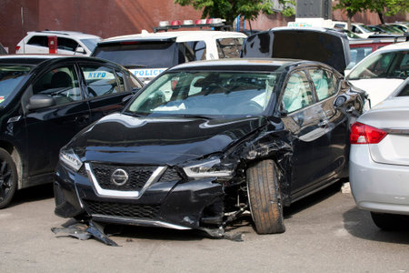 BRONX, NEW YORK/USA - May 18, 2020: A damaged vehicle parked and abandoned.のeditorial素材