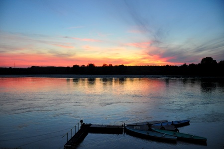 sunset colours reflected on Po riverの写真素材