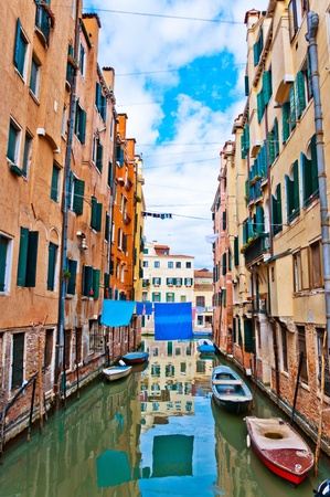 Venice, Italy - canal, boats and housesの写真素材