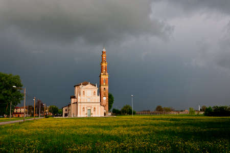 church and dramatic landscape in the village of Sesso, Italyの写真素材