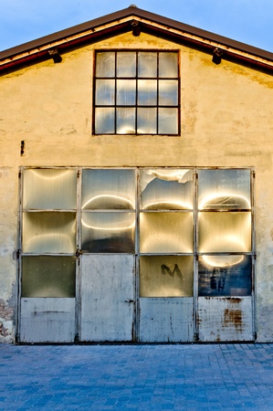 warehouse facade with sun reflectionsの写真素材