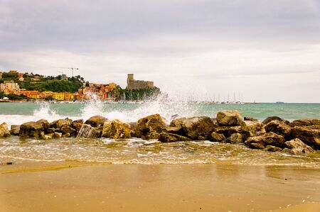 Lerici in Liguria with waves crashing on rocksの写真素材