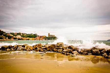 Lerici in Liguria with waves crashing on rocksの写真素材