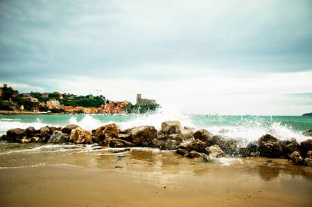 Lerici in Liguria with waves crashing on rocksの写真素材