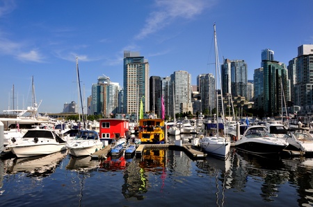 boats and reflections of Vancouver skyline from stanley parkの写真素材