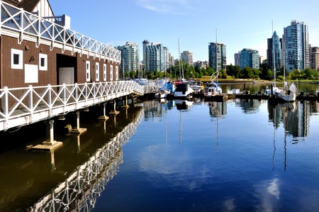 boats and reflections of Vancouver skyline from stanley parkの写真素材