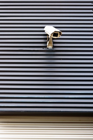 security cctv camera on a wall of commercial buildingの写真素材
