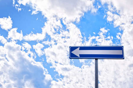 forced direction road sign with cloudy sky の写真素材