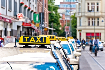 row of Taxi cabs waiting in Berlin downtown, Germanyのeditorial素材