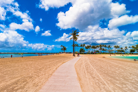 Honolulu, HI, USA - September 7, 2013  tourists sunbathing and swimming on Waikiki beach in Honolulu, Hawaii  Waikiki white sand beach shoreline is Hawaii s most famous beach のeditorial素材