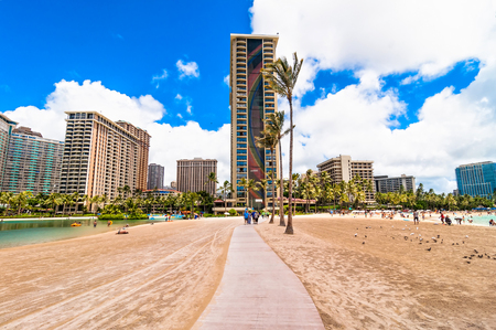 Honolulu, HI, USA - September 7, 2013  tourists sunbathing and swimming on Waikiki beach in Honolulu, Hawaii  Waikiki white sand beach shoreline is Hawaii s most famous beach のeditorial素材