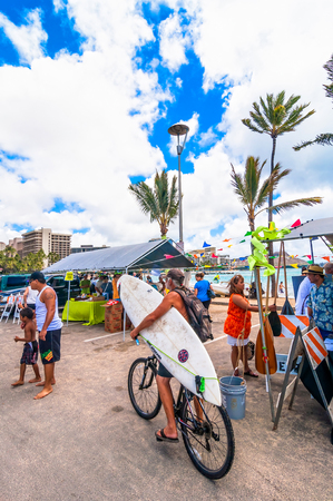 WAIKIKI, HAWAII - SEPTEMBER 7, 2013  Tourists and locals in Waikiki beach market in Honolulu, Hawaii  Waikiki white sand beach shoreline is Hawaii s most famous beach のeditorial素材