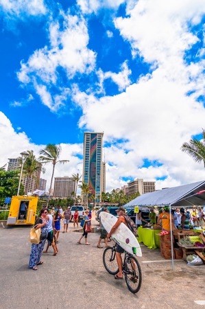 WAIKIKI, HAWAII - SEPTEMBER 7, 2013  Tourists and locals in Waikiki beach market in Honolulu, Hawaii  Waikiki white sand beach shoreline is Hawaii s most famous beach のeditorial素材