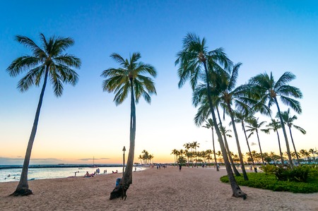 WAIKIKI, HAWAII - SEPTEMBER 7, 2013  sunset time in Waikiki beach, Honolulu, Hawaii  Waikiki white sand beach shoreline is Hawaii s most famous beach のeditorial素材