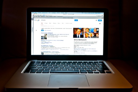 Milan, Italy - December 23, 2013  photo detail of laptop showing Google web search related to Silvio Berlusconi in Milan, Italy  Berlusconi is an Italian politician, entrepreneur, media tycoon  のeditorial素材