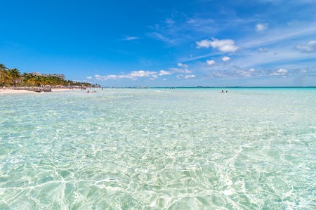 Isla Mujeres, Mexico - April 22, 2014: tourists enjoy tropical sea on famous Playa del Norte beach...