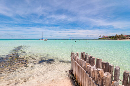 Isla Mujeres, Mexico - April 22, 2014: tourists enjoy tropical sea on famous Playa del Norte beach in Isla Mujeres, Mexico. The island is located 8 miles northeast of Canc?n in the Caribbean Seaのeditorial素材