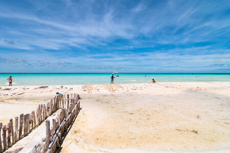Isla Mujeres, Mexico - April 22, 2014: tourists enjoy tropical sea on famous Playa del Norte beach in Isla Mujeres, Mexico. The island is located 8 miles northeast of Canc?n in the Caribbean Seaのeditorial素材