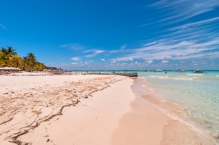 Isla Mujeres, Mexico - April 22, 2014: tourists enjoy tropical sea on famous Playa del Norte beach in Isla Mujeres, Mexico. The island is located 8 miles northeast of Canc?n in the Caribbean Seaのeditorial素材