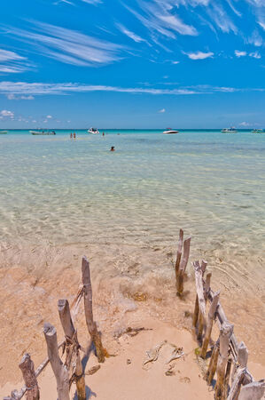 Isla Mujeres, Mexico - April 23, 2014: tourists enjoy tropical sea on famous Playa del Norte beach in Isla Mujeres, Mexico. The island is located 8 miles northeast of Canc?n in the Caribbean Seaのeditorial素材