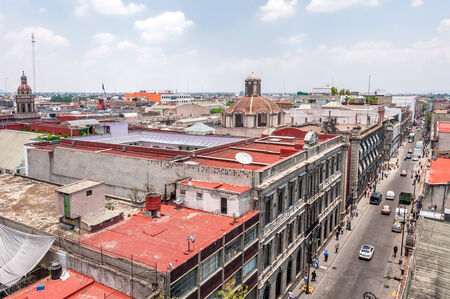 MEXICO CITY, MEXICO - APRIL 29, 2014: day view of Zocalo downtown with Catedral Metropolitana belfries in Mexico City, Mexico. The city is located at an altitude of 2,240 meters.