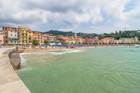 Lerici, Italy - June 29, 2014: locals and tourists enjoy San Terenzo beach and town in Lerici, Italy. Lerici is located in La Spezia Gulf of Potes, Liguria, and is famous for his bay, harbour and castleのeditorial素材