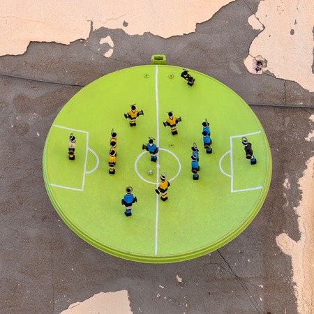 SYRACUSE, ITALY - AUGUST 17, 2014: art installation named La parabola del calcio by Alessandro Andolina on wall in Syracuse, Italy. Ortigia is a small island which is the historical centre of the city of Syracuse, Sicily.のeditorial素材