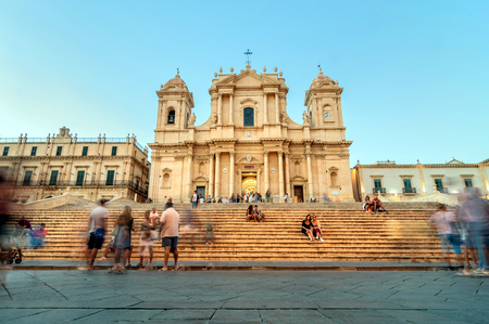NOTO, ITALY - AUGUST 18, 2014: tourists in front of Baroque Cathedral in Noto, Sicily. Built in 1776, Considered the jewel of European Baroque, partially collapsed During 1996 earthquake. In 2002 Noto and its church were declared a UNESCO World Heritage Sのeditorial素材