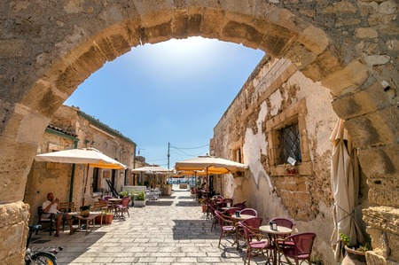 MARZAMEMI, ITALY -  AUGUST 19, 2014: tourists visit old village in Marzamemi, Italy. It is a small fishing village close to Italyのeditorial素材