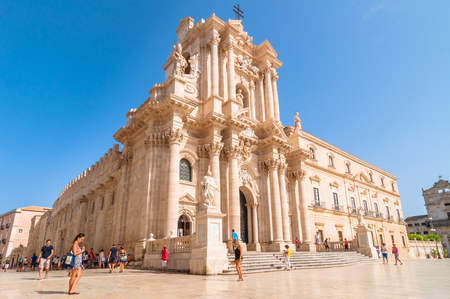 SYRACUSE, ITALY - AUGUST 16, 2014: tourists and locals visit main square Piazza del Duomo in Ortigia, Syracuse, Italy. Ortigia is a small island which is the historical centre of the city of Syracuse, Sicily.のeditorial素材