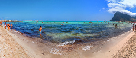 SAN VITO LO CAPO, ITALY - AUGUST 22, 2014: tourists and locals enjoy blue mediterranean sea in San Vito Lo Capo, Italy. This small town is located in a valley between spectacular mountains, and its famous beach has been elected best italian beach on TripAのeditorial素材