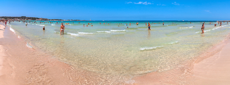 SAN VITO LO CAPO, ITALY - AUGUST 22, 2014: tourists and locals enjoy blue mediterranean sea in San Vito Lo Capo, Italy. This small town is located in a valley between spectacular mountains, and its famous beach has been elected best italian beach on TripAのeditorial素材