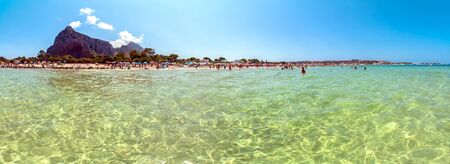 SAN VITO LO CAPO, ITALY - AUGUST 22, 2014: tourists and locals enjoy blue mediterranean sea in San Vito Lo Capo, Italy. This small town is located in a valley between spectacular mountains, and its famous beach has been elected best italian beach on TripAのeditorial素材