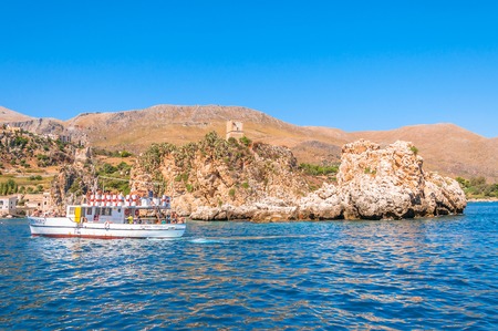 ZINGARO NATURAL RESERVE, ITALY - AUGUST 26, 2014: tourists enjoy blue mediterranean sea in Zingaro Natural Reserve, Italy. This National Park stretches along about 7 kilometers of unspoilt coastlineのeditorial素材