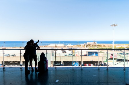 PALERMO, ITALY - AUGUST 27, 2014: passengers wait for their flights on terrace in Falcone Borsellino Airport in Palermo, Italy. The airport was named after the two leading anti-mafia judges murdered in 1992.のeditorial素材