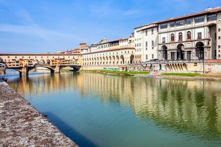 FLORENCE, ITALY - March 21, 2014: long exposure of river Arno, Ponte Vecchio and city skyline in  Florence, Italy. Florence is home to some of the most famous works of art on earth.のeditorial素材