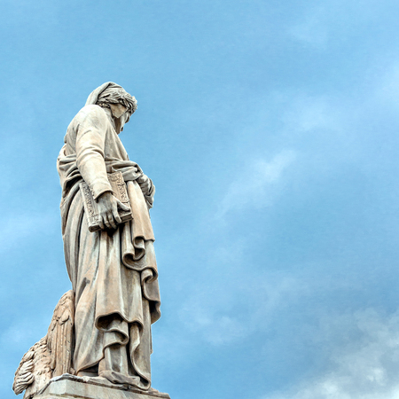 Dante Alighieri statue in front of Santa Croce church - Florence, Italyの写真素材