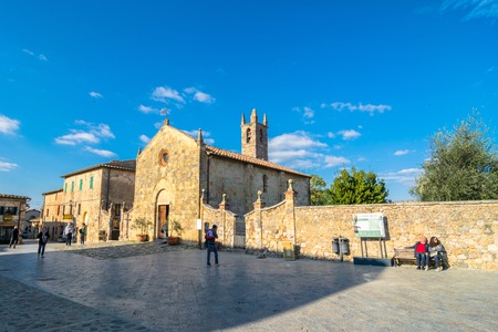 MONTERIGGIONI ITALY  October 26 2014: tourists visit main square in Monteriggioni Siena Italy. Monteriggioni is a medieval walled town located on a natural hillock.のeditorial素材