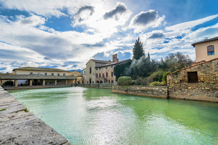 BAGNO VIGNONI, ITALY - January 25, 2015: old thermal baths in the heart of medieval village in Bagno Vignoni, Italy.  In 2004 Bagno Vignoni was added to the UNESCO list of World Heritage Sites.のeditorial素材