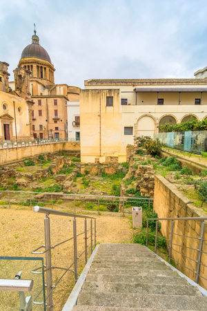 MARSALA, ITALY - FEBRUARY 22, 2014: day view of downtown buildings and Roman ruins in Marsala, Italy. The town is famous for the docking of Garibaldi on 11 May 1860 and for its wine.のeditorial素材