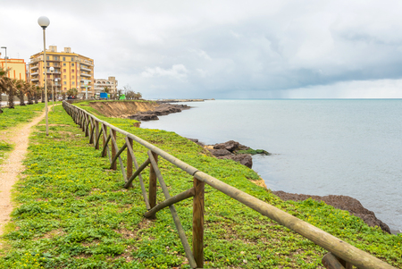 MARSALA, ITALY - FEBRUARY 22, 2014: day view of coastline and mediterranean sea with dramatic sky in Marsala, Italy. The town is famous for the docking of Garibaldi on 11 May 1860 and for its wine.のeditorial素材