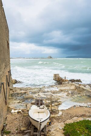 TRAPANI, ITALY - FEBRUARY 25, 2014: day view of boat and waterfront in Trapani, Italy. The city is an important fishing port and the main gateway to the nearby Egadi Islandsのeditorial素材