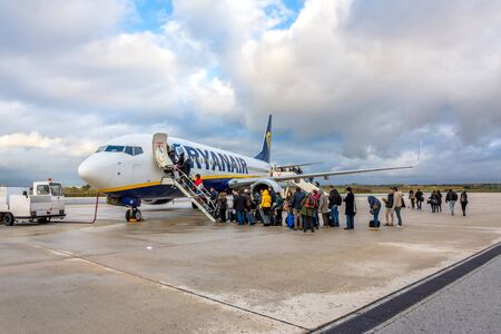 TRAPANI, ITALY - FEBRUARY 25, 2014: passengers boarding Ryanair Jet airplane in Trapani airport, Italy. Ryanair is the biggest low-cost airline company in the world.のeditorial素材