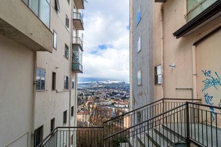 POTENZA, ITALY - MARCH 13, 2015: panoramic day view of city and mountains in Potenza, Italy. Potenza is the highest regional capital city in Italy.のeditorial素材