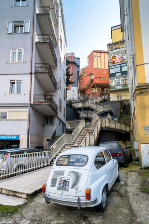 POTENZA, ITALY - MARCH 13, 2015: day view of downtown street and old FIAT 600 car in Potenza, Italy. Potenza is the highest regional capital city in Italy.のeditorial素材