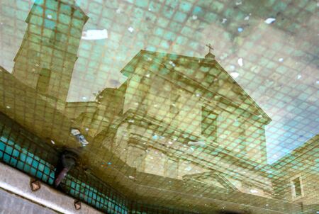 POTENZA, ITALY - MARCH 13, 2015: day view of Duomo San Gerardo Cathedral reflected in fountain in...